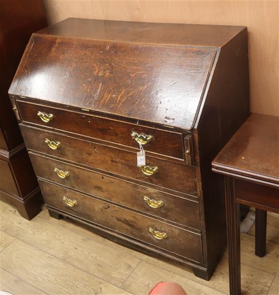 A George III oak bureau W.107cm